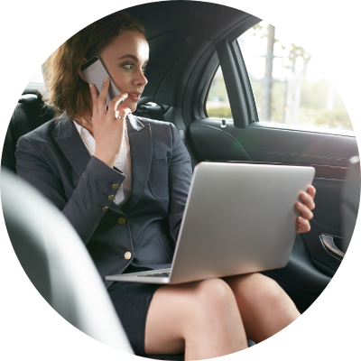 Female CEO working inside car